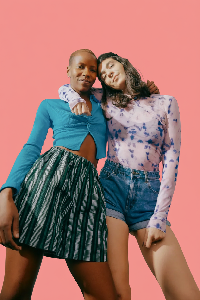 Black and white photo of a women performing modern dance on a dark background.